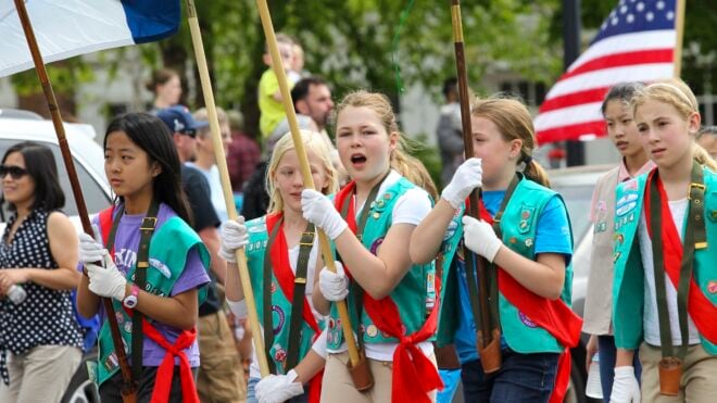 Girl scouts marching in parade