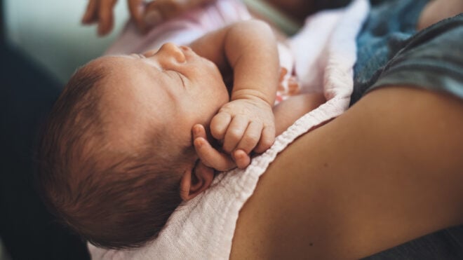 mom holding newborn baby