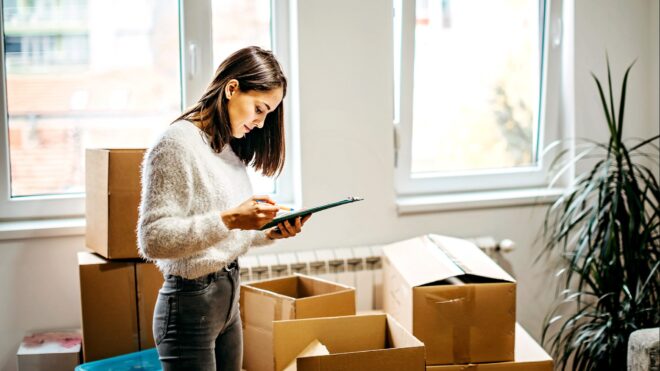 A woman packing up a house