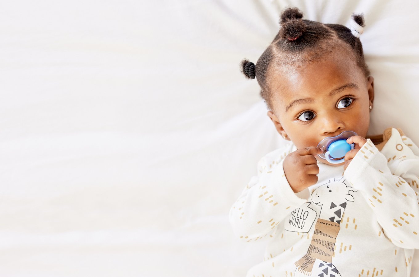 Baby girl with a pacifier