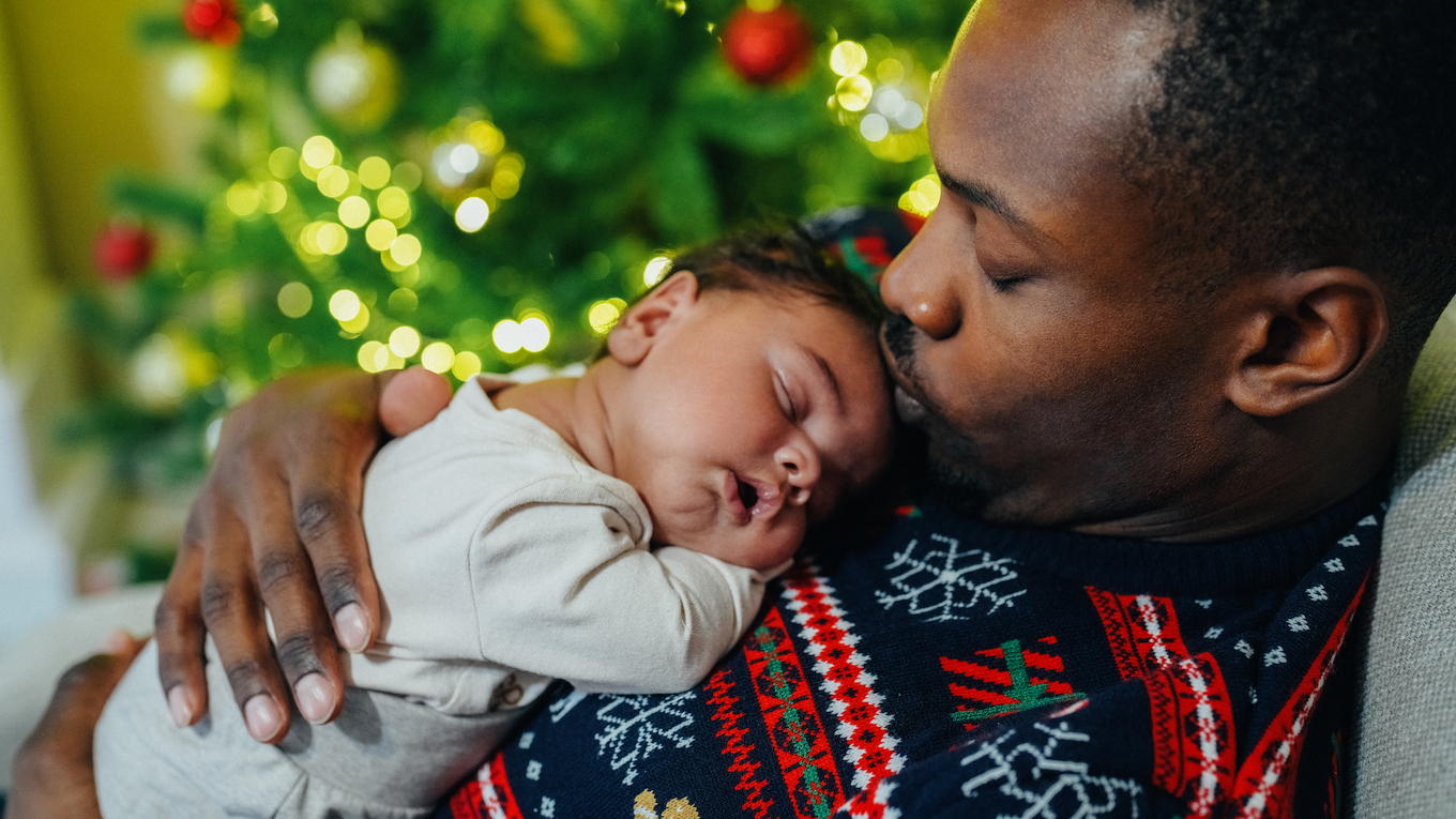 A dad and his sleeping baby