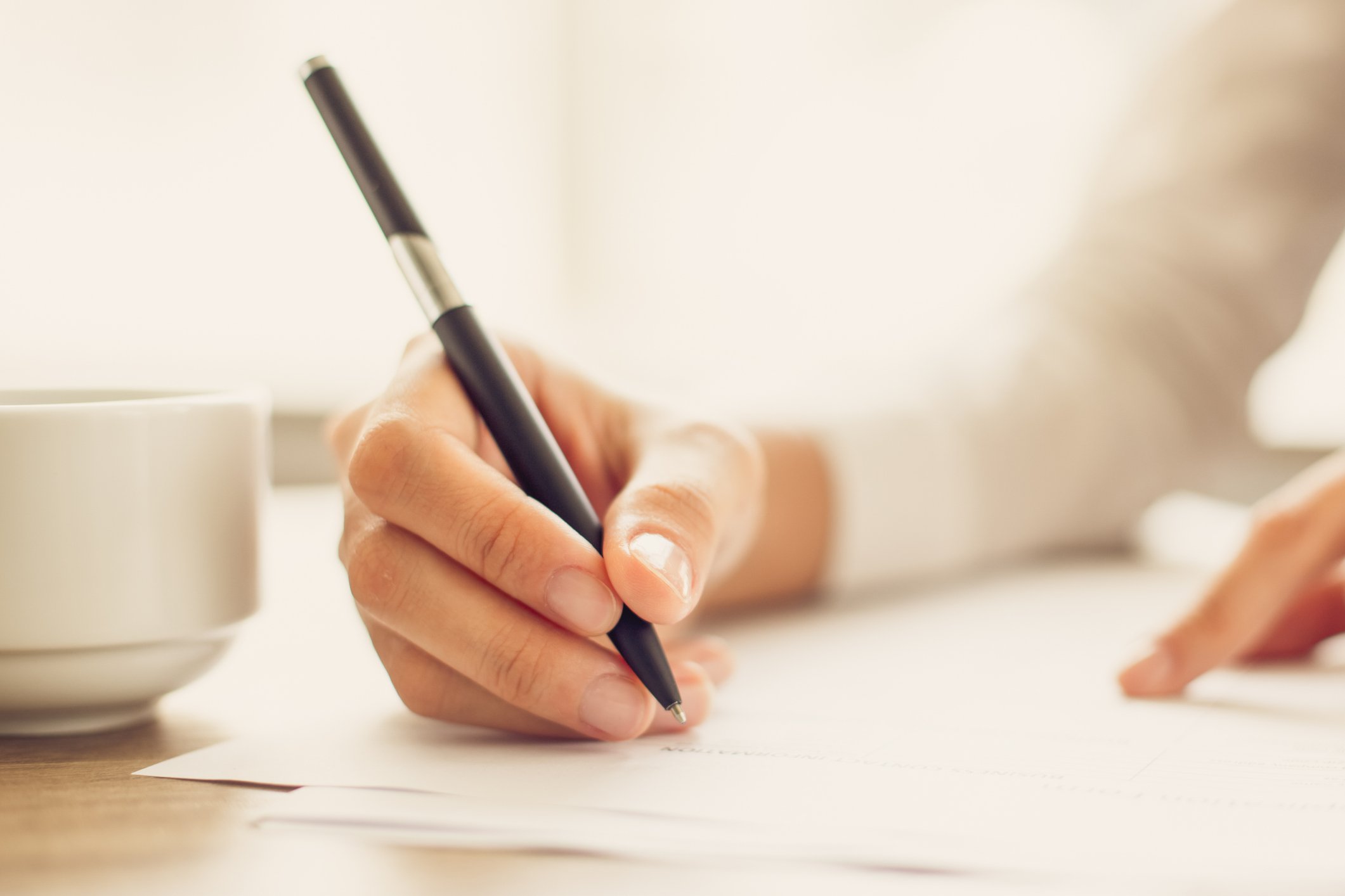 woman writing thank you cards